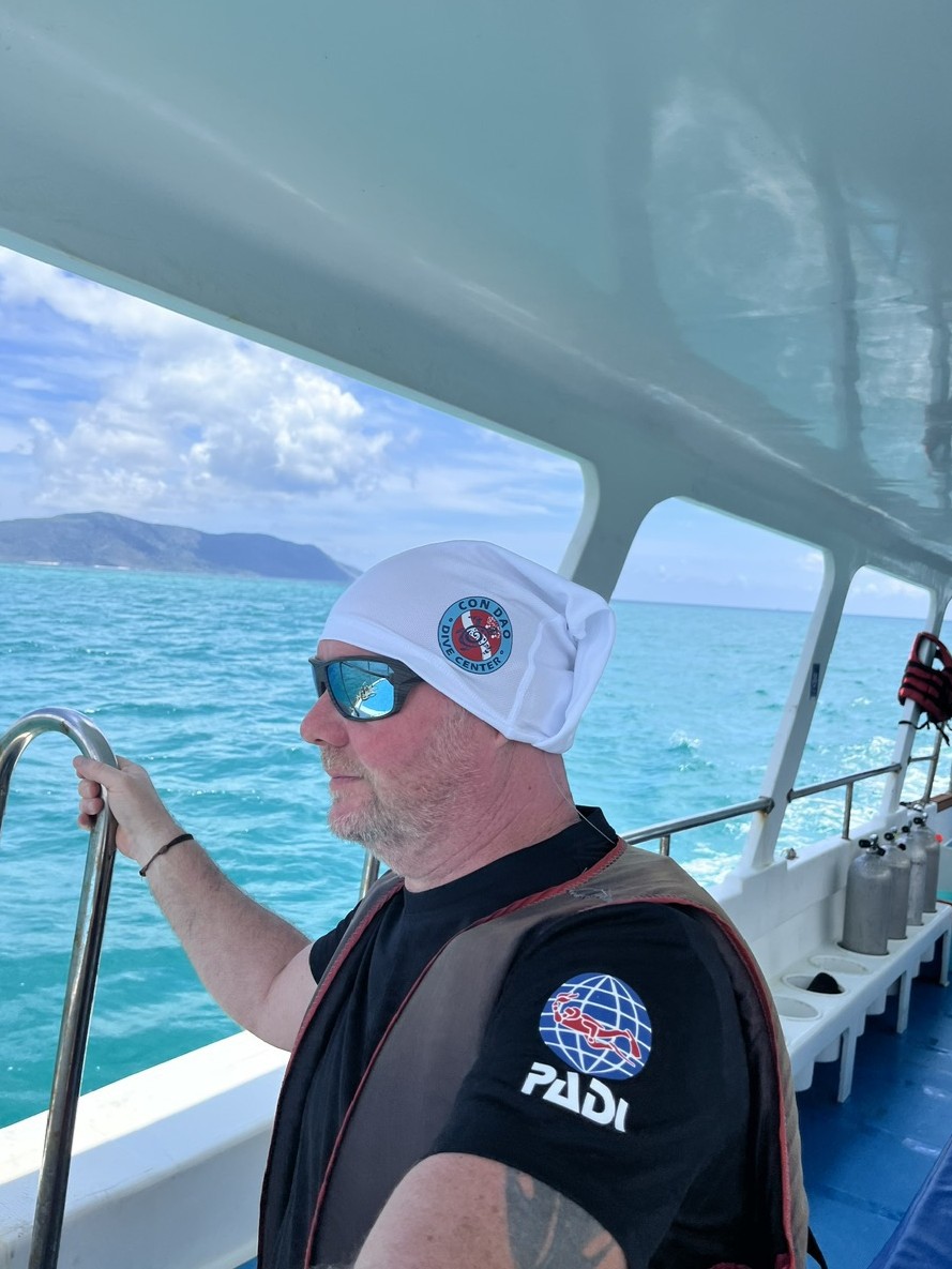 Guest wearing CDDC buff during Turtle Experience Tour in Con Dao